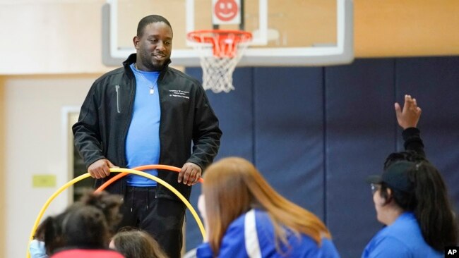 Anthony Gaylor works with children in a before- and afterschool program operated by the YMCA of Middle Tennessee in Nashville, Tenn.