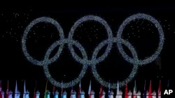 FILE - The Olympic rings during the closing ceremony of the 2022 Winter Olympics, Feb. 20, 2022, in Beijing.