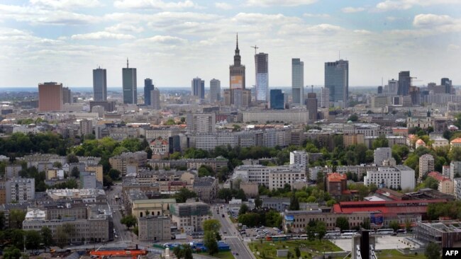 FILE - Aerial view from a helium balloon shows downtown Warsaw and the Vistula River with the Swietokrzyski Bridge, May 18, 2012.