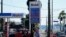 FILE - Gas prices are displayed at a gas station on March 11, 2022, in Long Beach, California.