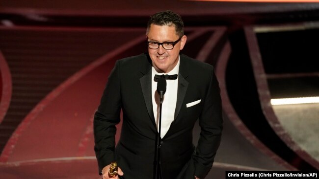 Greig Fraser accepts the award for best cinematography for "Dune" at the Oscars on Sunday, March 27, 2022, at the Dolby Theatre in Los Angeles.