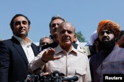 Leader of the opposition parties Mian Muhammad Shehbaz Sharif, brother of ex-prime minister Nawaz Sharif, addresses a news conference outside the parliament building, in Islamabad, Pakistan, March 25, 2022.