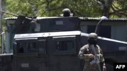 Salvadorean soldiers patrol the streets following the government's declaration of state of emergency, in San Salvador, on March 27, 2022.