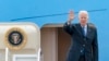 FILE - President Joe Biden waves as he boards Air Force One at Andrews Air Force Base, Md., March 23, 2022.