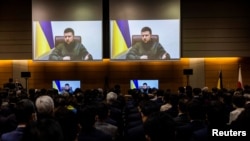 Ukraine's President Volodymyr Zelenskiy addresses Japan's lower house of the parliament via video-link at the House of Representatives office building in Tokyo, Japan March 23, 2022. Behrouz Mehri/Pool via REUTERS