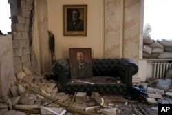 Rubble fills the regional administration building, heavily damaged after a Russian attack earlier this month in Kharkiv, Ukraine, March 24, 2022.