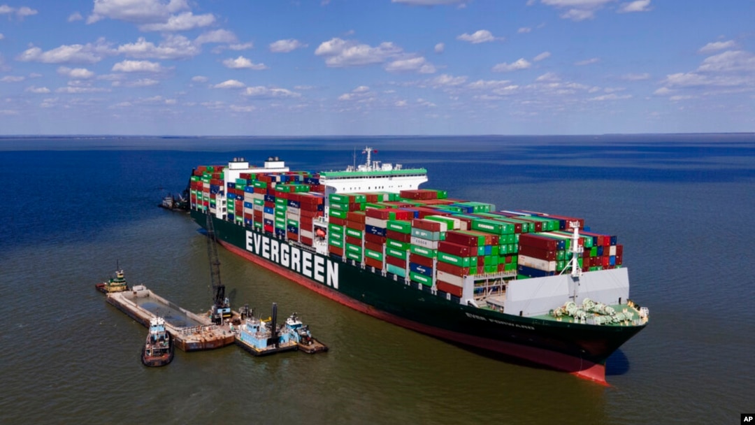 Crews dredge near the container ship Ever Forward in efforts to free it after it ran aground off the coast near Pasadena, Md., March 21, 2022.