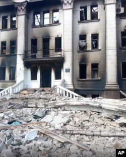 This image made available by Azov Battalion, shows the drama theater, damaged after shelling, in Mariupol, Ukraine, March 17, 2022.