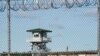 FILE - In this April 16, 2018, photo, a guard tower stands above the Lee Correctional Institution, a maximum-security prison in Bishopville, S.C.