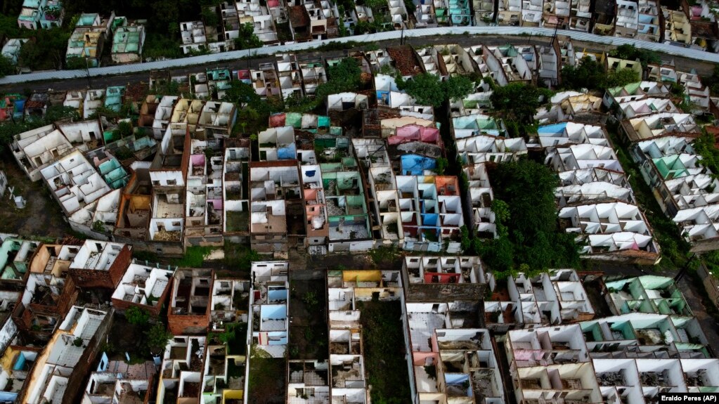 Homes stand abandoned in Maceio, Alagoas state, Brazil, Sunday, March 6, 2022. The homes have been abandoned because of the threat of ground subsidence caused by the Braskem mine that has forced more than 55 thousand people from their homes. (AP Photo/Eraldo Peres)