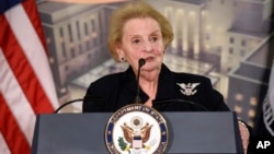 FILE - Former U.S. Secretary of State Madeleine Albright speaks at a reception celebrating the completion of the U.S. Diplomacy Center Pavilion at the State Department in Washington, Jan. 10, 2017. 