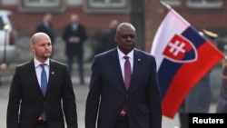Slovakia's Defense Minister Jaroslav Nad walks with U.S. Secretary of Defense Lloyd Austin at the Ministry of Defense of the Slovak Republic in Bratislava, Slovakia, March 17, 2022.