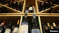 FILE - Bottles of South African wine are displayed among others at a supermarket in Beijing, China, Feb. 4, 2021. 