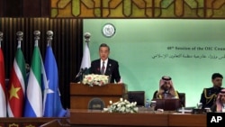 Chinese Foreign Minister Wang Yi speaks at the start of a two-day gathering of the 57-member Organization of Islamic Cooperation, at the Parliament House in Islamabad, Pakistan, March 22, 2022. 