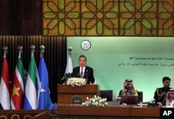 Chinese Foreign Minister Wang Yi speaks at the start of a two-day gathering of the OIC, at the Parliament House in Islamabad, Pakistan, March 22, 2022.