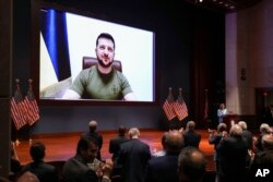 Ukraine President Volodymyr Zelenskyy gives a virtual address to the U.S. Congress in Washington, March 16, 2022.