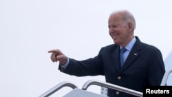 President Biden boards Air Force One at Joint Base Andrews in Maryland en route to Brussels, Belgium, where he will attend an extraordinary NATO summit to discuss efforts in response to Russia's attack on Ukraine, March 23, 2022. 