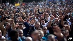 FILE - African migrants chant slogans during a protest in Rabin's square in Tel Aviv, Israel, Sunday, Jan. 5, 2014. 