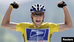 U.S. Postal Service Team rider Lance Armstrong of the United States raises his arms as he crosses the finish line to win the 204.5 km long 17th stage of the Tour de France from Bourd-d'Oisans to Le Grand Bornand, France, July 22, 2004. 