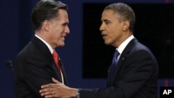 Republican presidential nominee Mitt Romney and President Barack Obama shake hands.