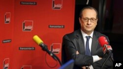 French President Francois Hollande is seen taking a question during an interview with radio station France Inter in Paris Jan. 5, 2015.