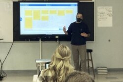 Conor Murphy, a teacher at West Genesee High School, in Camillus, N.Y., conducts his "Participation in Government" class, Thursday, Jan. 7, 2021.