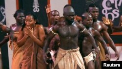 FILE - Ghanaian actors perform a show on slavery at Elmina castle in Cape Coast, March 25, 2007. One of travel company Altruvistas' trips looks at slavery in Ghana.