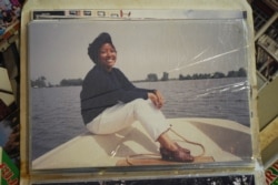 FILE - A photo of Ros Sopheap, Executive Director of Gender and Development for Cambodia (GADC), in her youthful time during late 1980s to 2000s, from her personal album, in Phnom Penh, July 6, 2021. (Khan Sokummono/VOA Khmer)