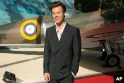 Harry Styles poses for photographers upon arrival at the World premiere of the film 'Dunkirk' in London, Thursday, July 13th, 2017.