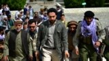 FILE - Ahmad Massoud (C), son of late Afghan commander Ahmad Shah Massoud, arrives to attend and address a gathering at the tomb of his late father, in Panjshir province, Afghanistan, July 5, 2021. 