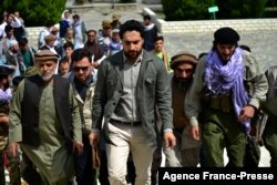 FILE - Ahmad Massoud (C), son of the late Afghan commander Ahmad Shah Massoud and leader of the National Resistance Front, arrives to attend and address a gathering at the tomb of his late father, in Panjshir province, Afghanistan, July 5, 2021.