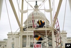 Construction continues on the inaugural platform in preparation for the swearing-in ceremonies for President-elect Donald Trump on the Capitol steps in Washington, Dec. 8, 2016.