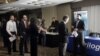 Job seekers line up at a job fair in Boston. While overall unemployment for Asian-Americans remains below the national average, their rate of long-term unemployment is the highest. 