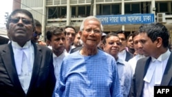 Bangladeshi Nobel laureate Muhammad Yunus, center, addresses the media at the Special Judge Court in Dhaka on June 12, 2024. Yunus was indicted in a corruption case, the latest charges to proceed against the respected economist that supporters say are politically motivated.