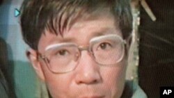 Veteran Chinese activist Qin Yongmin, shown in this April 1998 photo made off video while reading the declaration of a human rights group in Wuhan, will be put on trial for subversion of state power Thursday, Dec. 17, 1998 with another activist this week.