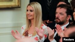 White House Senior Advisor Ivanka Trump applauds along with White House Director of the Domestic Policy Council Joe Grogan at an event held by President Donald Trump to tout his administration's environmental policies at the White House, July 8, 2019.