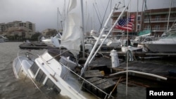 A boat is damaged by Hurricane Sally in Pensacola, Florida, Sept. 16, 2020. 