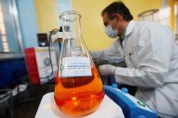 A locally made testing component for the coronavirus disease (COVID-19), as it's produced by a group of researchers from Basra University, is seen in Basra, Iraq March 29, 2020.