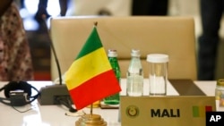 The seat of the representative of Mali stands empty during the fifth extraordinary summit in Accra, Ghana, March 25, 2022. 