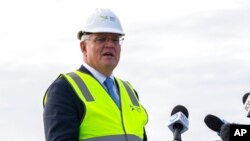 FILE - Australian Prime Minister Scott Morrison visits a new airport site in Sydney, March 28, 2022. 