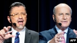 This combination of pictures created April 1, 2022, shows Costa Rican presidential candidates Rodrigo Chaves, left, and Jose Maria Figueres during a debate in San Jose, on March 29, 2022.