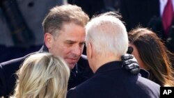 FILE - President Joe Biden hugs first lady Jill Biden, his son Hunter Biden and daughter Ashley Biden after being sworn-in during the 59th Presidential Inauguration at the US Capitol in Washington, Jan. 20, 2021.