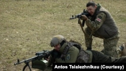 Belarusian fighters of the Kastus Kalinouski battalion train in Kyiv region, March 2022. (Courtesy: Antos Tsialezhnikau)
