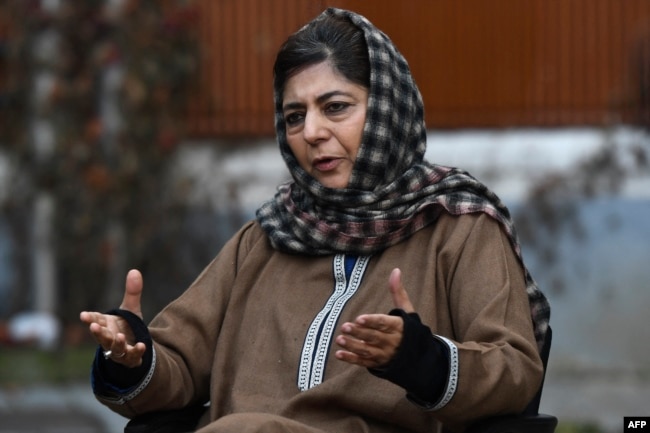 FILE - People's Democratic Party (PDP) leader and former chief minister of Jammu and Kashmir Mehbooba Mufti speaks during a press conference at her house in Srinagar, Dec. 23, 2020.
