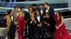 The cast and crew of "CODA" accept the award for best picture at the Oscars, March 27, 2022, at the Dolby Theatre in Los Angeles.