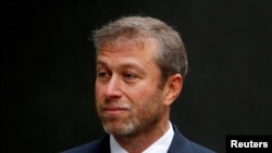 FILE - Russian billionaire Roman Abramovich arrives at a division of the High Court in central London, Oct. 31, 2011. 