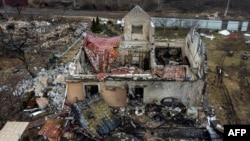 This aerial view taken near Kyiv, Ukraine, on March 30, 2022, shows a destroyed house in the village of Lukianivka.