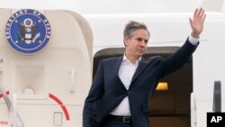 U.S. Secretary of State Antony Blinken waves as he boards his plane in Warsaw, Poland, March 26, 2022, departing for Israel.