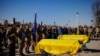 A funeral is held for two Ukraine soldiers who were killed in battle during Russia's attack on Ukraine, at the Lychakiv cemetery in Lviv, Ukraine, March 28, 2022.