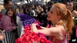 Jessica Chastain, who is nominated for a Best Actress award arrives at the Oscars on Sunday, March 27, 2022, at the Dolby Theatre in Los Angeles. (AP Photo/John Locher)